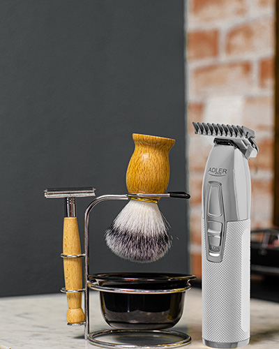 Beard shaving tools and a golden hair clipper
